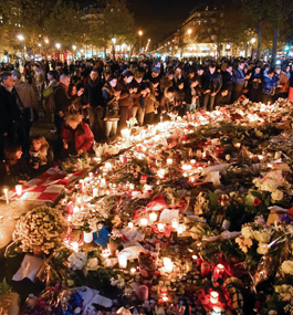 AFTERMATH: Parisians gather to honor the victims of the November 2015 terrorist attack in the French capital.